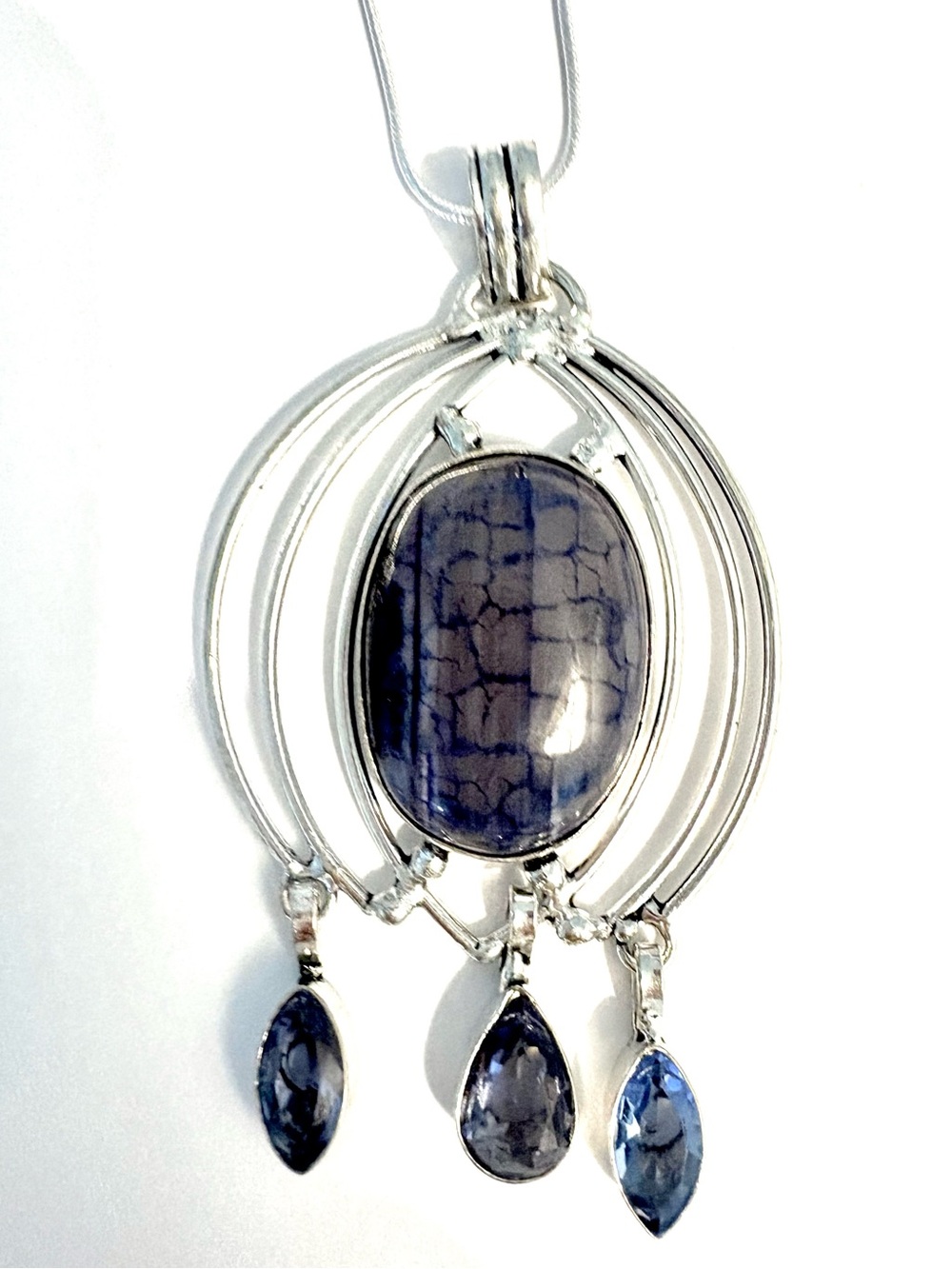 3 inch, 925 marked, Solar Agate and Blue Topaz pendant on a silver chain.